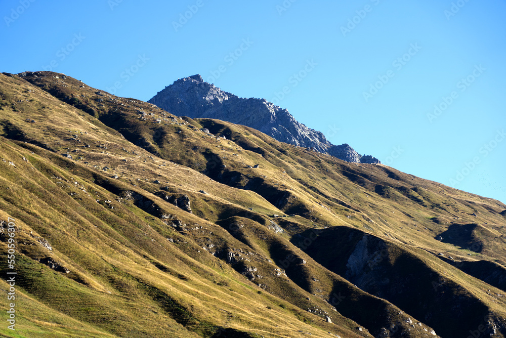 Scenic landscape at Swiss mountain valley Urserntal, Canton Uri, in the Swiss Alps on a sunny late summer day. Photo taken September 12th, 2022, Ursern Valley, Switzerland. Scenic landscape at Swiss mountain valley Urserntal, Canton Uri, in the Swiss Alps on a sunny late summer day. Photo taken September 12th, 2022, Ursern Valley, Switzerland.