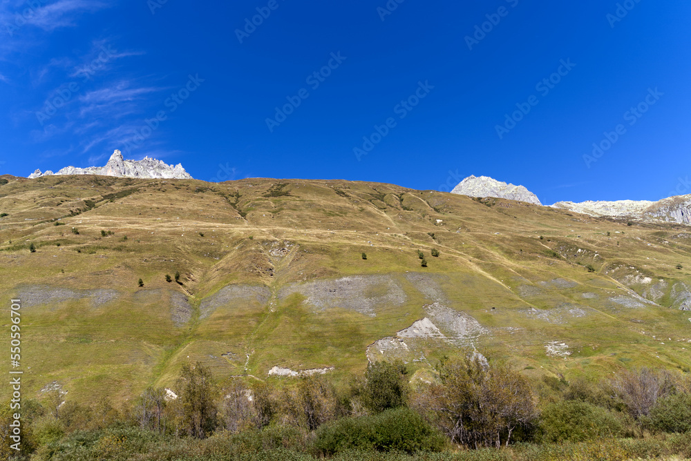Scenic landscape at Swiss mountain valley Urserntal, Canton Uri, in the Swiss Alps on a sunny late summer day. Photo taken September 12th, 2022, Ursern Valley, Switzerland.