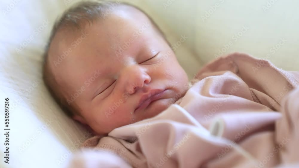 newborn baby girl falling a asleep. baby sleeping close up in bed at home. happy family kid dream concept. newborn baby girl lifestyle falls asleep twirls funny eyes newborn baby girl falling a asleep. baby sleeping close up in bed at home. happy family kid dream concept. newborn baby girl lifestyle falls asleep twirls funny eyes
