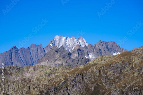 Scenic view of mountain panorama at famous Swiss mountain pass Furkapass with rocks and mountain peak on a sunny late summer day. Photo taken September 12th, 2022, Furka Pass, Switzerland.