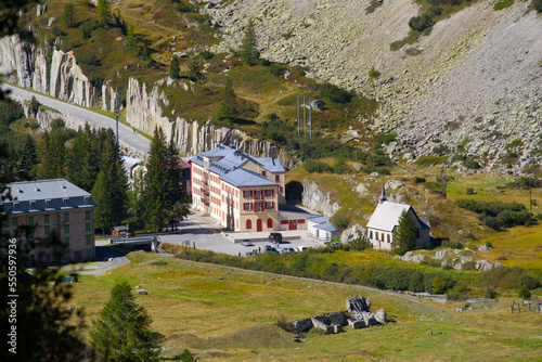 Scenic view of famous mountain hamlet Gletsch, Canton Valais, with Grimsel mountain pass road on a sunny late summer day. Photo taken September 12th, 2022, Gletsch, Switzerland.