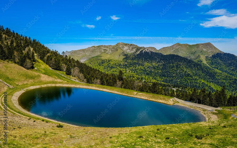 Mourtis, France - May 20th 2021: The small pond near the summit of Tuc de l'Étang near Mourtis ski resort, a peak in the Pyrenees Mountains range in the south of France