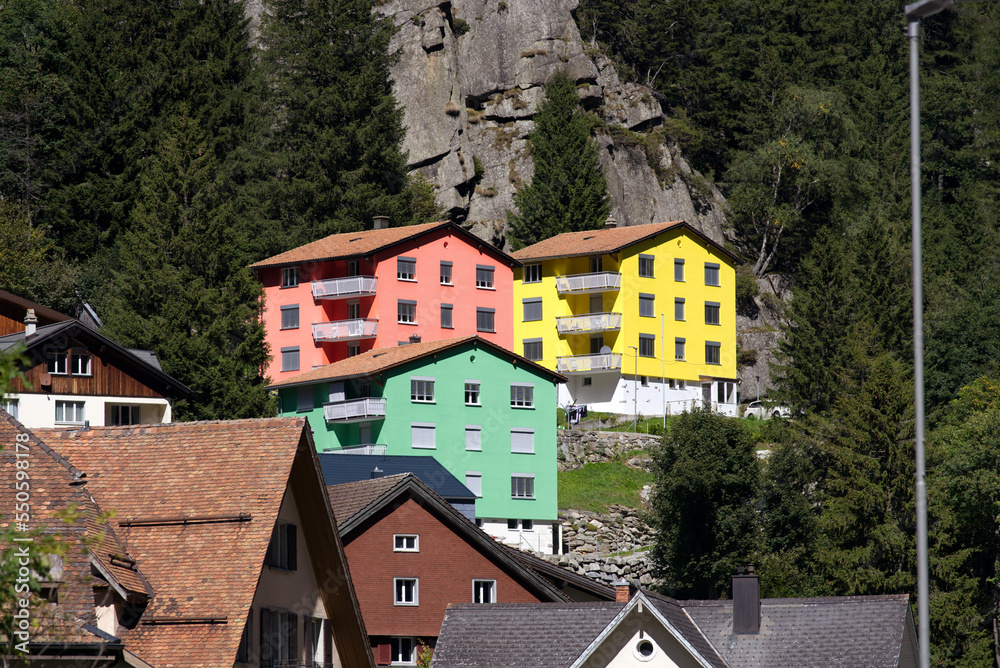 Mountain village Göschenen with beautiful colored houses on a sunny late summer day. Photo taken September 12th, 2022, Göschenen, Switzerland.