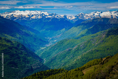 View on the snow covered Pyrenees mountains range from the summit of Tuc de l'étang in the south of France near Mourtis ski resort