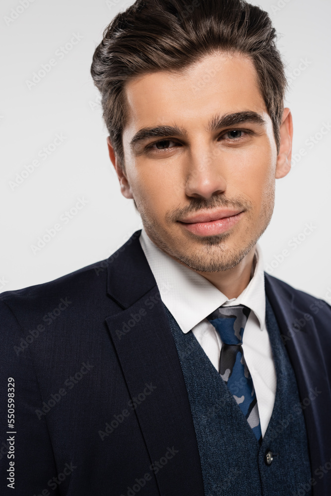 portrait of businessman in suit looking at camera isolated on gray portrait of businessman in suit looking at camera isolated on gray
