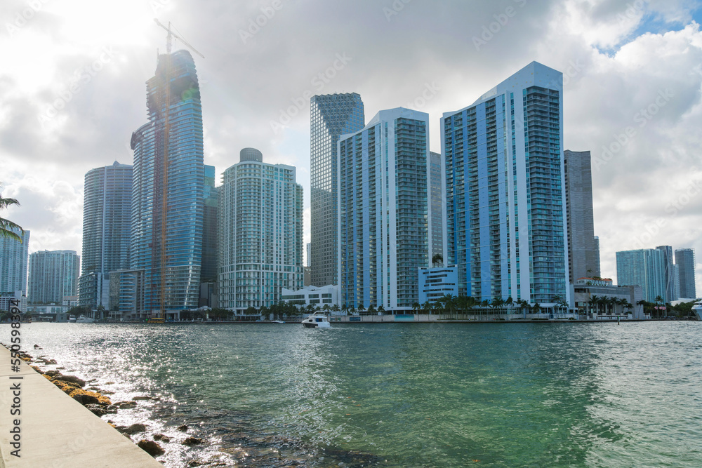 Fototapeta premium Views of sunlight over the tower crane outside the high-rise buildings at the bay in Miami, Florida
