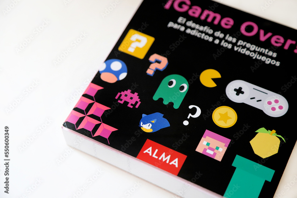 Naklejka premium Book for fans of video games. Game Over book from Alma publishing house. Pacman, Super Mario Bros, Minecraft, Sonic, Space Invaders. Joystick. Paper book.