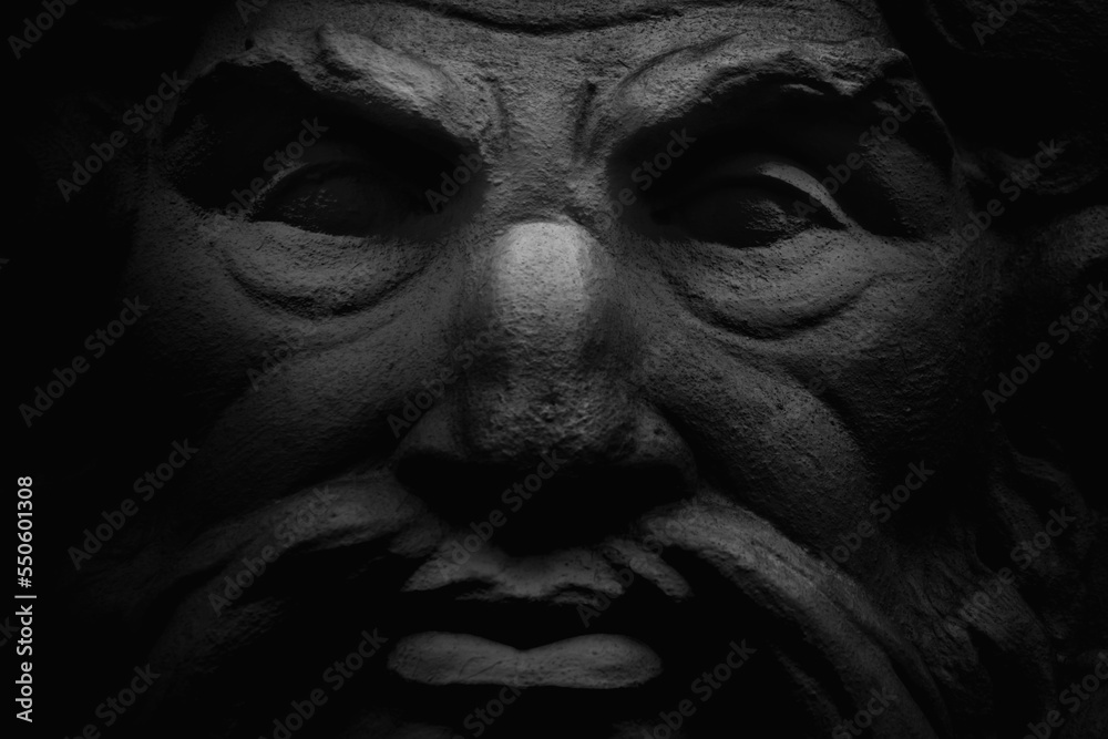 Close up face of the god Zeus (Jupiter). The king of Olympian gods and the ruler of sky and thunder. Fragment of an ancient statue. Close up face of the god Zeus (Jupiter). The king of Olympian gods and the ruler of sky and thunder. Fragment of an ancient statue.