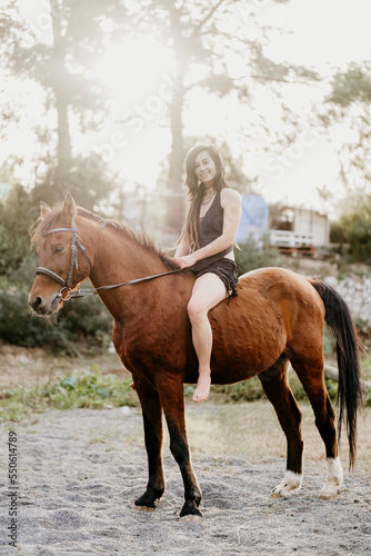 Amazon girl riding her horse without a saddle.