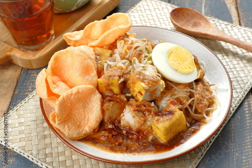 ketoprak-indonesian Traditional street food.dish of rice cake,rice noodles, bean curd, egg,boiled sprouts and served with peanut dressing.