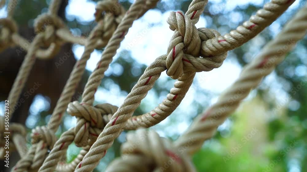 Close up climb net rop select focus green nature background. Close up climb net rop select focus green nature background.