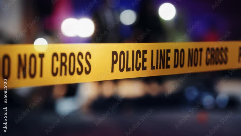 Close Up on Crime Scene Yellow Tape Showing Text 