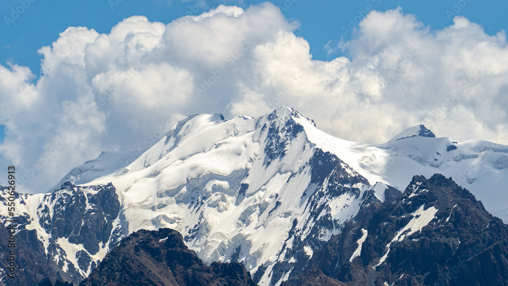 permafrost. glaciers. snowy mountain peaks and cliffs. snowy mountains in hot summer. mountain peaks in the clouds permafrost. glaciers. snowy mountain peaks and cliffs. snowy mountains in hot summer. mountain peaks in the clouds
