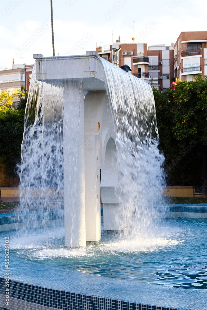 Striking fountain with cascading water in a garden in the city of Murcia