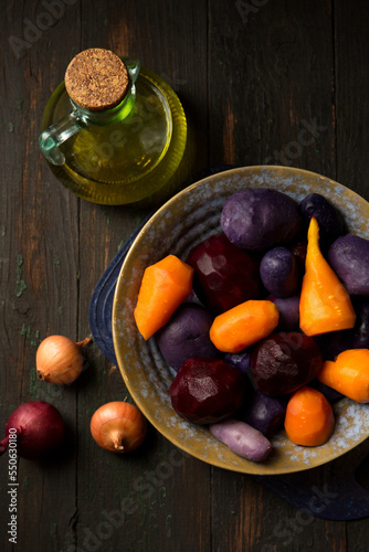 purple potatoes and vegetables for salad vinaigrette, top view