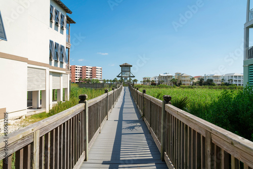 Boardwalk over the tall grasses in a residential area at Destin, Florida