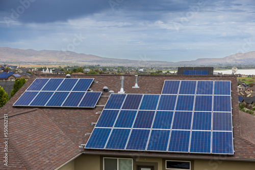 Solar panels on roof of home on a cloudy day