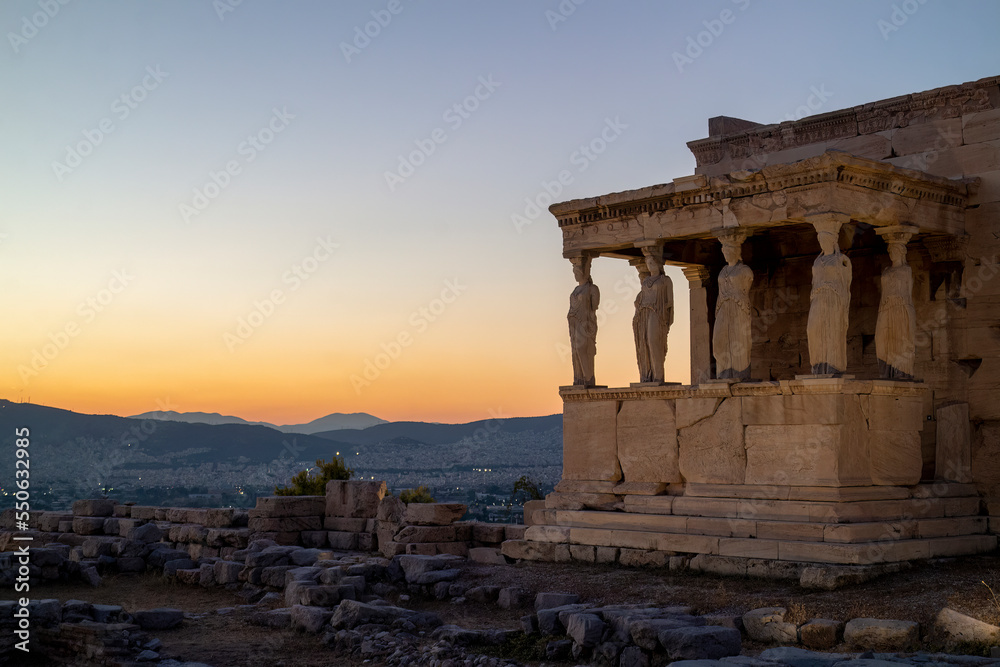 View of the Erechteion by night in the Acropolis Hill in Athens, Greece