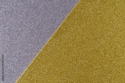 Background of shiny gray and golden paper in bright colors, geometric pattern