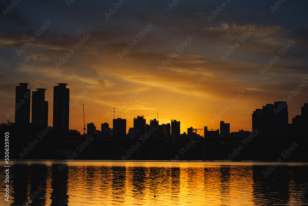 After sunset, golden sky, city skyline silhouette and golden Han River