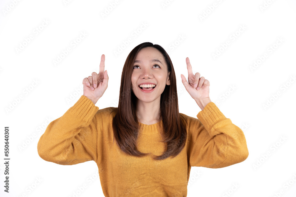 Young beautiful smiling good mood positive girl pointing finger in copyspace isolated on white background. Young beautiful smiling good mood positive girl pointing finger in copyspace isolated on white background.