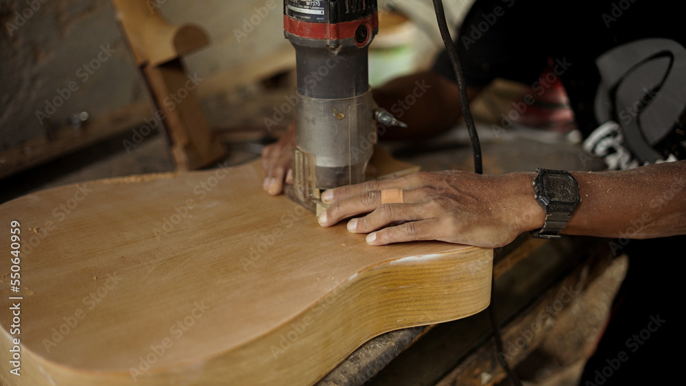 Handmade guitar making at workshop with wood