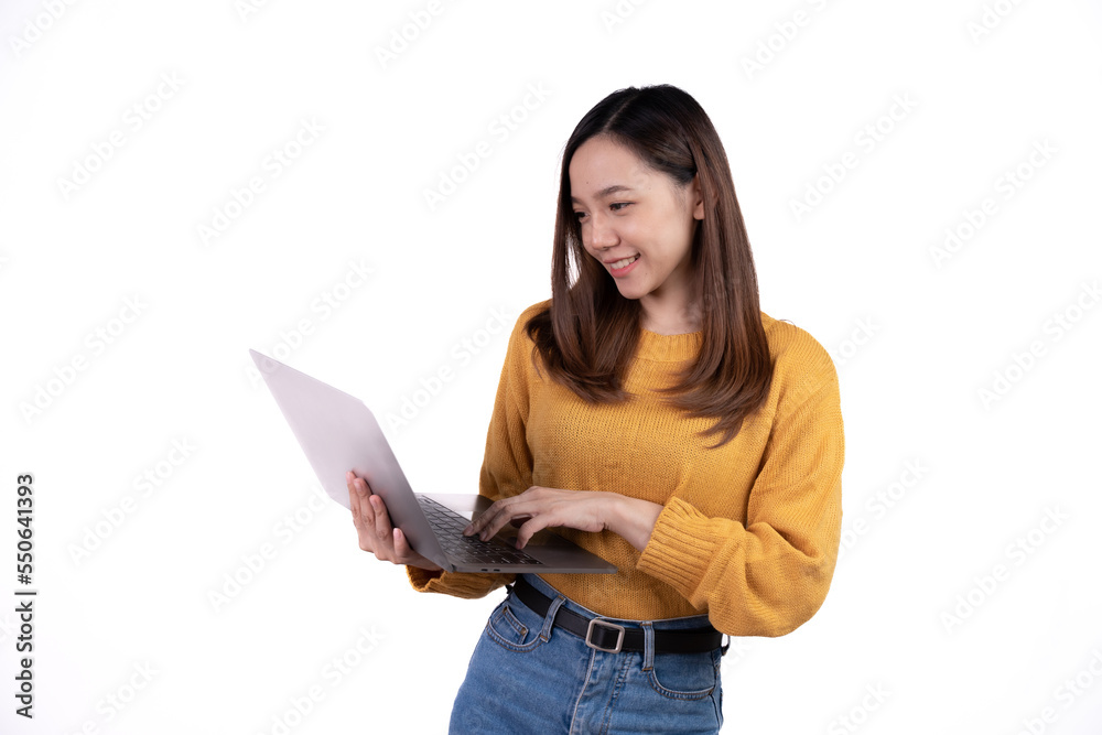 Portrait of a happy asian businesswoman holding laptop computer and looking away isolated over white background. Portrait of a happy asian businesswoman holding laptop computer and looking away isolated over white background.