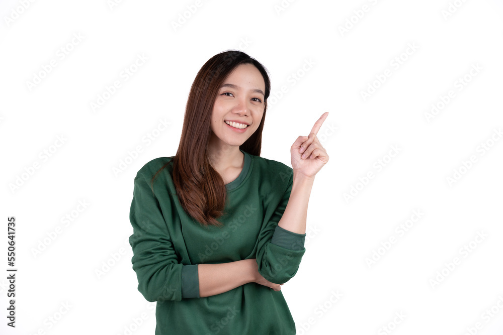 Young beautiful smiling good mood positive girl pointing finger in copyspace isolated on white background. Young beautiful smiling good mood positive girl pointing finger in copyspace isolated on white background.