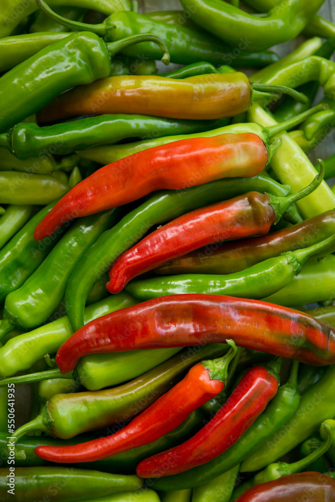 Hot chili pepper background. Red and green peppercorns as a background. Healthy food concept.