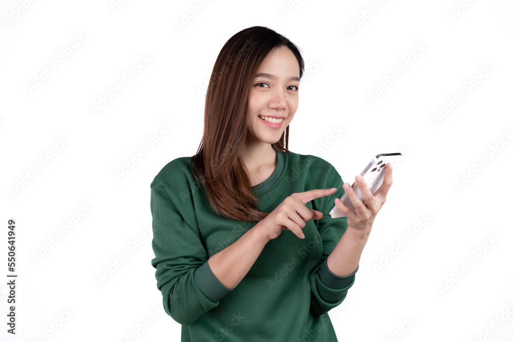 Portrait of a smiling casual asian woman holding smartphone over white background. Portrait of a smiling casual asian woman holding smartphone over white background.