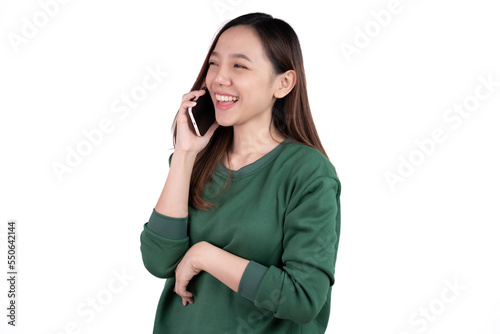 Portrait of a smiling casual asian woman holding smartphone over white background.