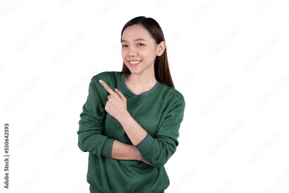 Young beautiful smiling good mood positive girl pointing finger in copyspace isolated on white background. Young beautiful smiling good mood positive girl pointing finger in copyspace isolated on white background.