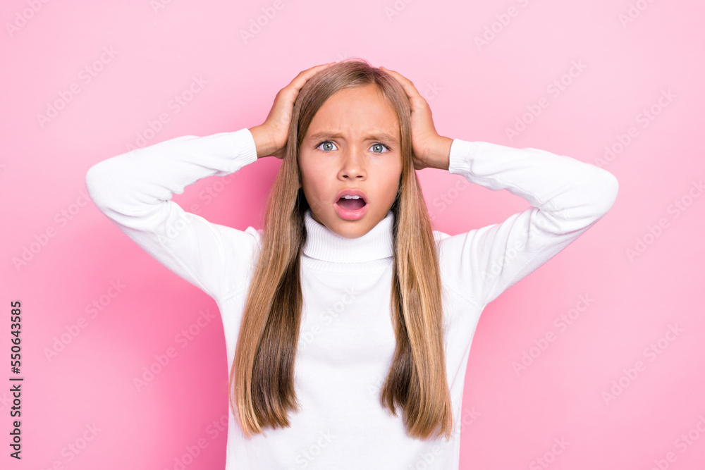 Portrait of impressed schoolchild hands touch head open mouth stare isolated on pink color background Portrait of impressed schoolchild hands touch head open mouth stare isolated on pink color background