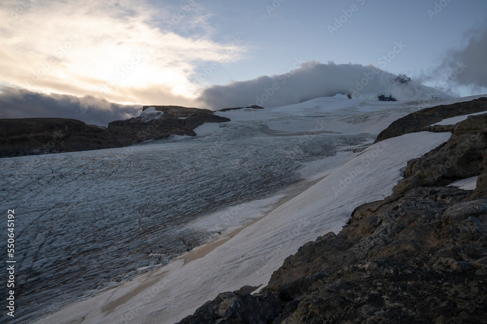 Fototapeta premium Alpine landscape. View of Tronador hill and Castaño Overo glacier ice field at sunset in the Andes cordillera, Patagonia Argentina.
