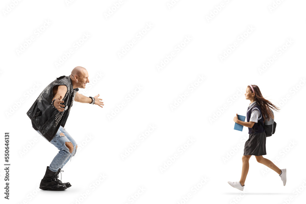 Full length profile shot of a schoolgirl running to hug a rock music star Full length profile shot of a schoolgirl running to hug a rock music star