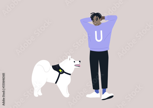 A young male African pet owner and their samoyed dog looking at each other, friendship with animals