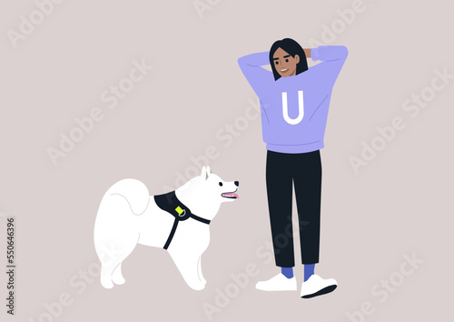A young female Caucasian pet owner and their samoyed dog looking at each other, friendship with animals