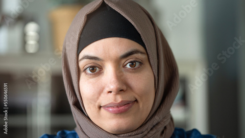Woman looking at camera and wearing a hijab photo
