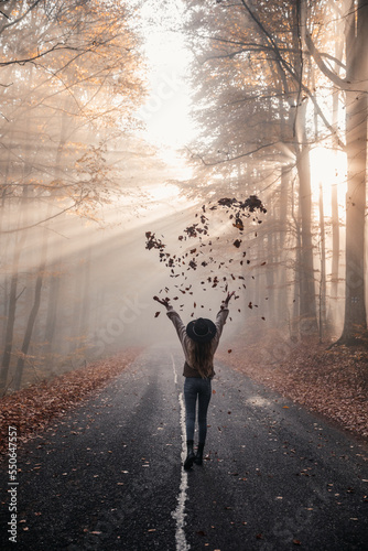 Happy girl in autumnal fore...