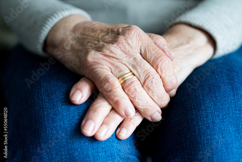Hands of an elderly widow close up photo