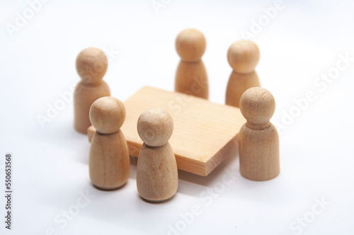Wooden figure having meeting with with white background. Meeting concept