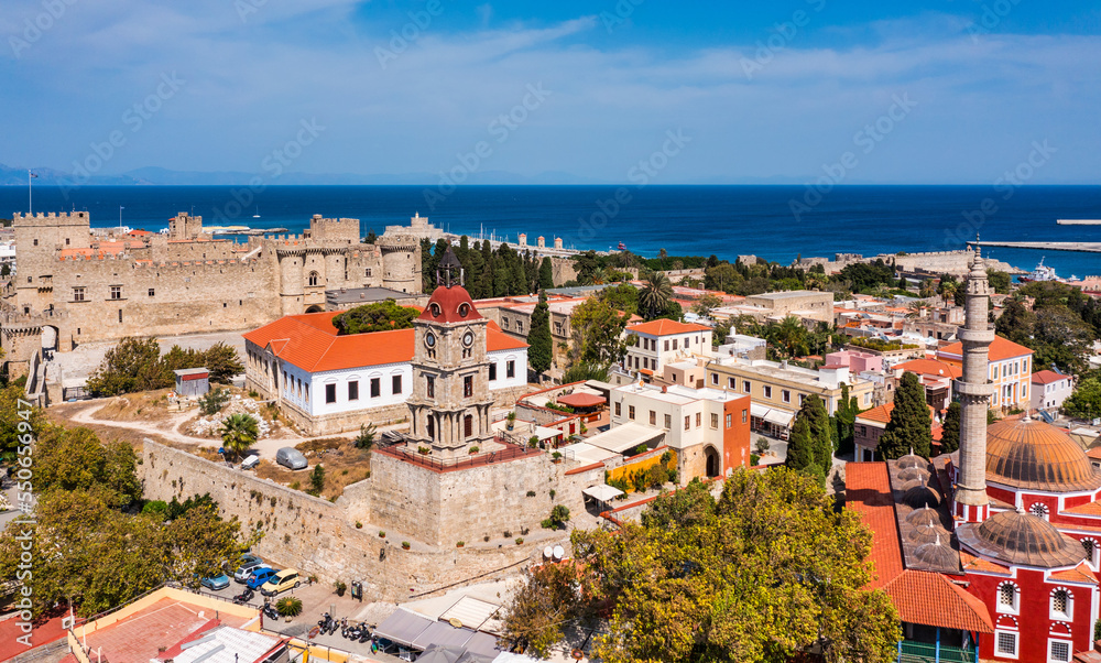 Panoramic view of Rhodes old town on Rhodes island, Greece. Rhodes old fortress cityscape with sea port at foreground. Travel destinations in Rhodes, Greece.