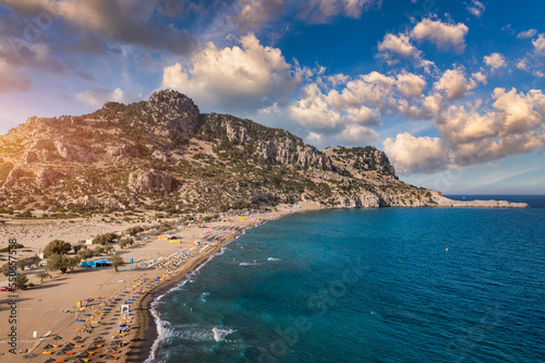 Tsampika beach with golden sand view from above, Rhodes, Greece. Aerial birds eye view of famous beach of Tsampika, Rhodes island, Dodecanese, Greece