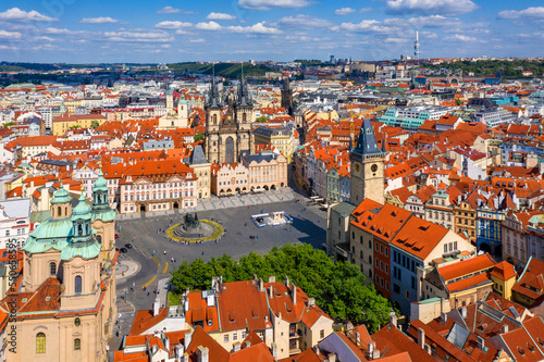 Wallpaper Mural Prague beautiful panoramic sunny aerial drone view above Prague Old Town Square with Church of Our Lady before Tyn and Prague Astronomical Clock Tower. Drone flight over red roofs of Prague, Czechia. Torontodigital.ca