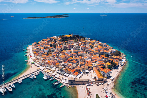 Aerial view of Primosten old town on the islet, Dalmatia, Croatia. Primosten, Sibenik Knin County, Croatia. Resort town on the Adriatic coast. Aerial view of adriatic town Primosten, Croatia