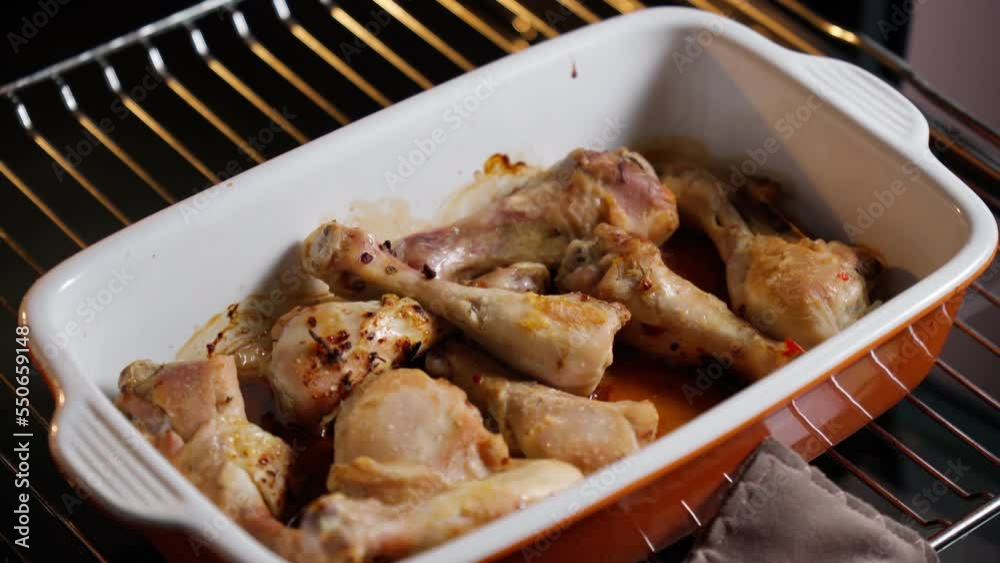 Cooking chicken legs in the oven. Home cooking bakery, delicious and nutritious food. Selective focus Cooking chicken legs in the oven. Home cooking bakery, delicious and nutritious food. Selective focus