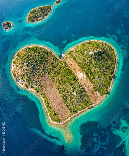 Aerial view of the heart shaped Galesnjak island on the adriatic coast, Zadar, Croatia. Heart shaped island of Galesnjak in Zadar archipelago aerial view, Dalmatia region of Croatia. photo