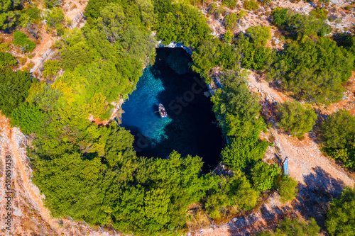 Famous Melissani lake on Kefalonia island, Karavomylos, Greece. On top of Melissani Cave (Melissani Lake) in Karavomylos village in Kefalonia island , Greece. Melissani Cave viewed from above.