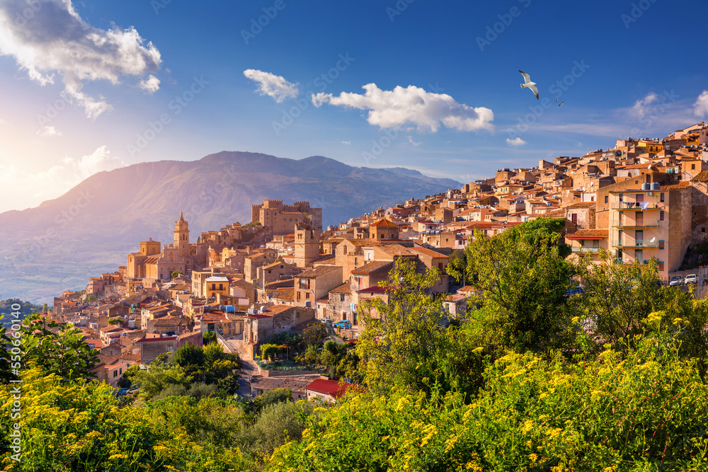 Caccamo, Sicily. Medieval Italian city with the Norman Castle in Sicily mountains, Italy. View of Caccamo town on the hill with mountains in the background, Sicily, Italy.