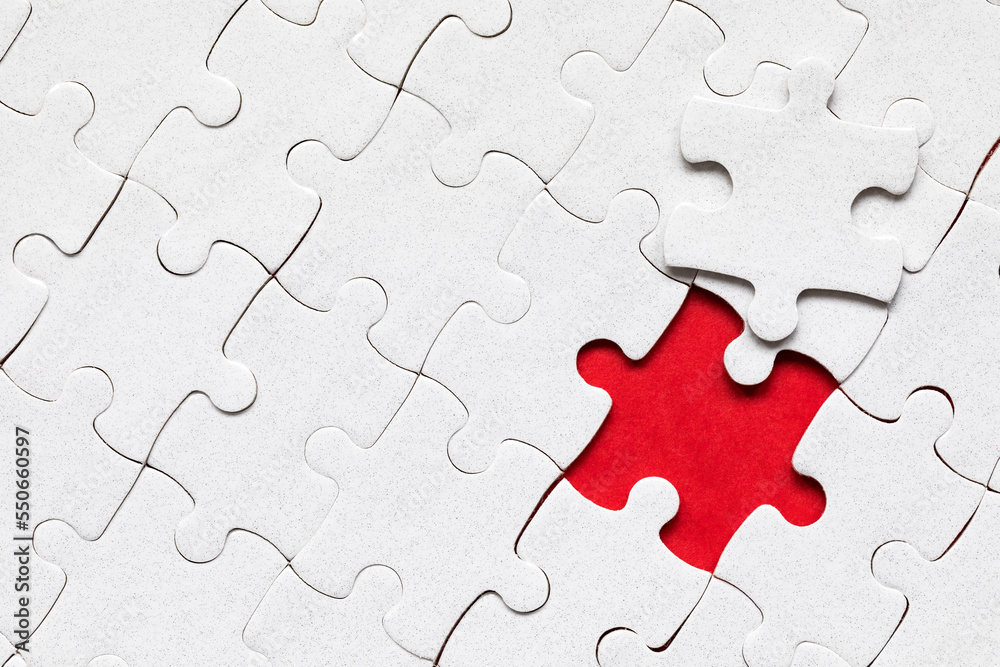 White jigsaw puzzle pieces. Fill in pieces of the jigsaw puzzle. Complete the jigsaw puzzle with the missing pieces. Fragment of a folded white jigsaw puzzle. White jigsaw puzzle pieces. Fill in pieces of the jigsaw puzzle. Complete the jigsaw puzzle with the missing pieces. Fragment of a folded white jigsaw puzzle.